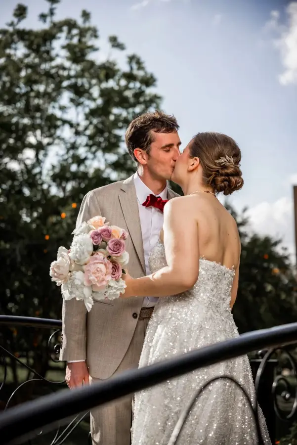 Bride and groom first kiss above the orange grove - wedding photographer Marrakech